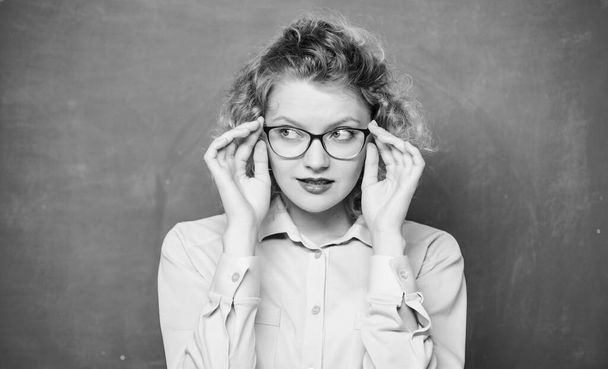 Playful teacher. Woman school teacher shy and pretty lady wear eyeglasses chalkboard background. Adorable nerd. Sexy teacher concept. Smart girl teaching you. Let me see. Attractive educator - Photo, Image