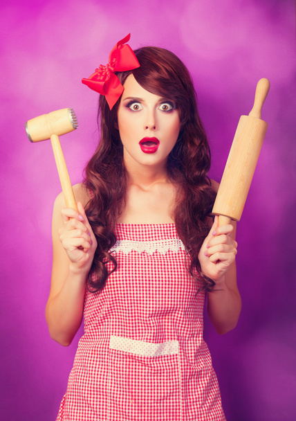 Beautiful brunette housewife with rolling pin on violet backgrou - Φωτογραφία, εικόνα