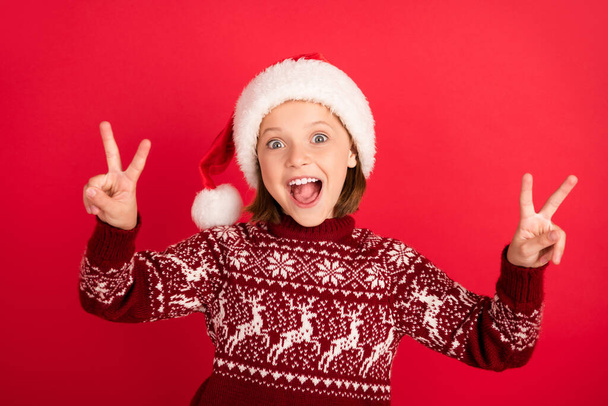Portrait of attractive cheerful girl showing double v-sign having fun good mood isolated over bright red color background - Fotoğraf, Görsel
