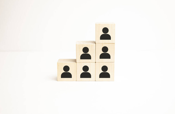 Human resources management and recruitment business build team concept. Wooden cube block on top with icon - Foto, imagen