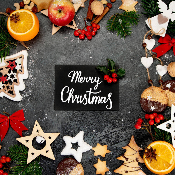 Christmas composition on dark background. Festive background. Top view, flat lay, copy space - Fotoğraf, Görsel