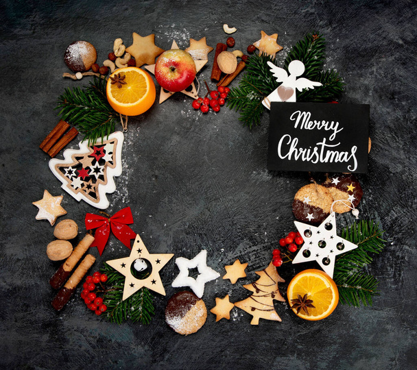 Christmas composition on dark background. Festive background. Top view, flat lay, copy space - Foto, Imagem