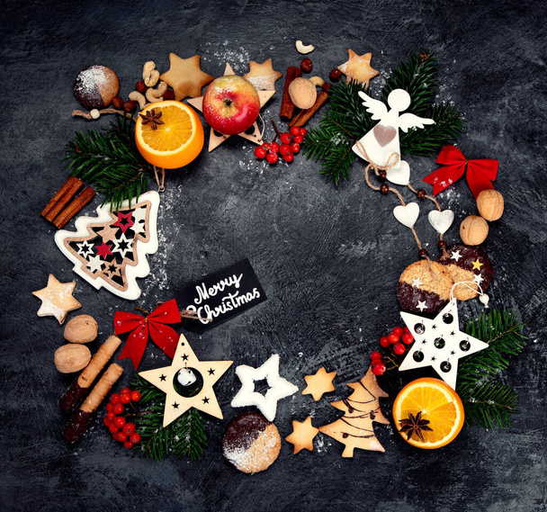 Christmas composition on dark background. Festive background. Top view, flat lay, copy space - Fotoğraf, Görsel