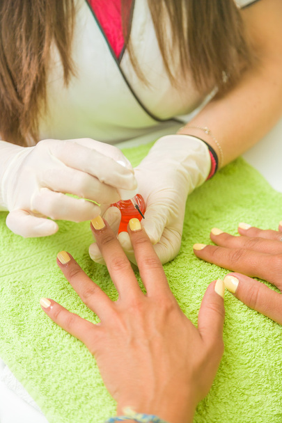 Woman getting a manicure  - Foto, imagen