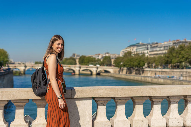 Female tourist in front of Sainte Chapelle in Paris, France - Fotó, kép