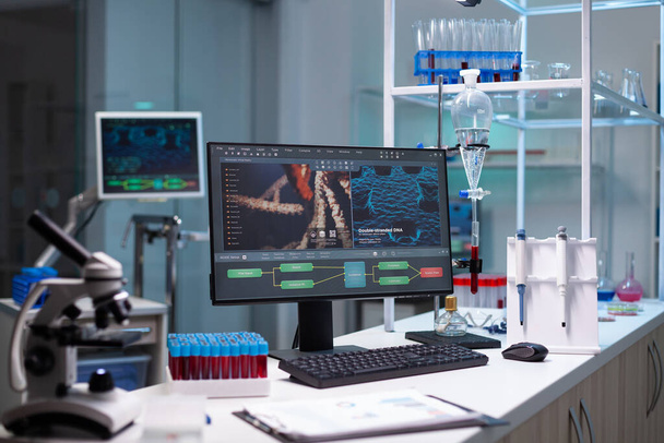 Empty laboratory with scientific monitor on desk - Фото, изображение