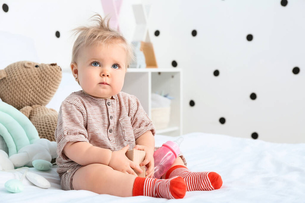 Adorable baby girl in bedroom - Photo, image