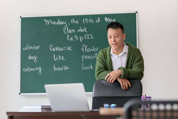 Asian teacher conducting English lesson online - Photo, Image
