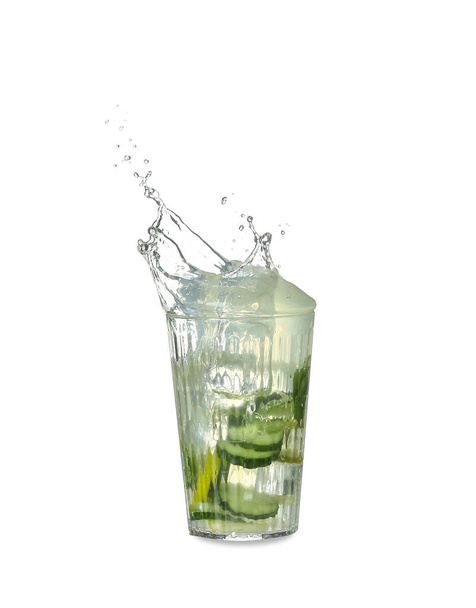 Glass of splashing lemonade on white background - Photo, Image