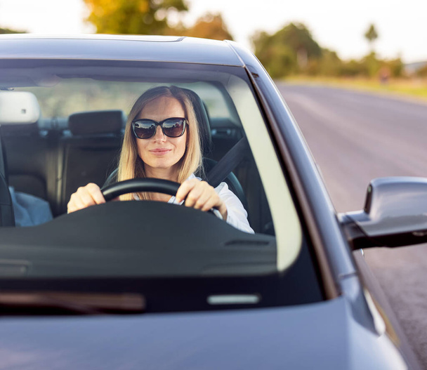 Confident woman driving car - Foto, Imagem