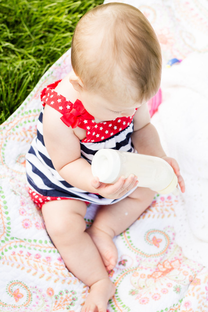 Cute baby girl with her bottle - Photo, Image