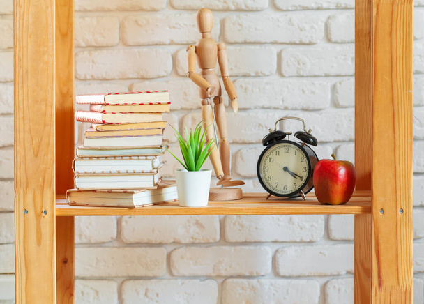 Wooden rack shelf with home decor stuff - Foto, imagen