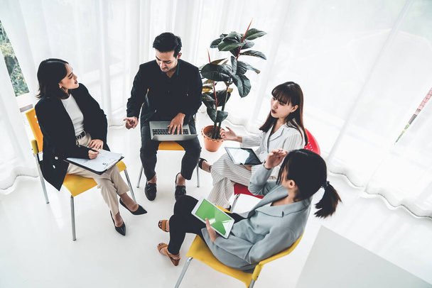 Business people proficiently discuss work project while sitting in circle - Foto, Imagem