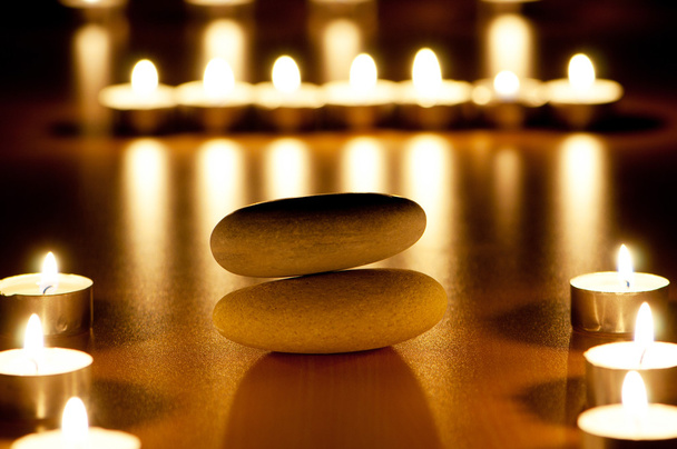 Burning candles and pebbles for aromatherapy session - Foto, Imagem