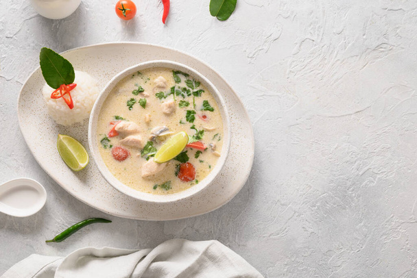 Asian Tom Kha Gai soup. Spicy coconut with chicken, cherry tomato. - Фото, изображение