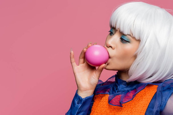Pretty asian pop art woman blowing bubble gum isolated on pink  - Fotoğraf, Görsel