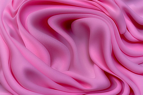 Zbliżenie tekstury naturalnej czerwieni lub karmazynu lub różowej tkaniny. Tekstura tkaniny z naturalnej bawełny, jedwabiu lub wełny lub lnu materiału włókienniczego. Czerwone i pomarańczowe tło płótna. - Zdjęcie, obraz