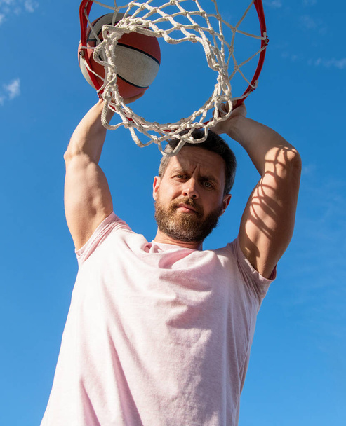 guy has sport motivation. sport and hobby. dunk in basket. slam dunk in motion. - Photo, Image