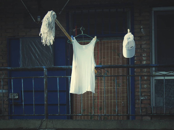 a beautiful wedding dress hanging on a hanger - Photo, Image