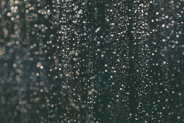 Rain drops background in dark time of day - 写真・画像