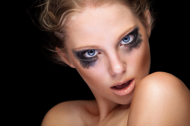 Sensual girl with make up on black background - 写真・画像