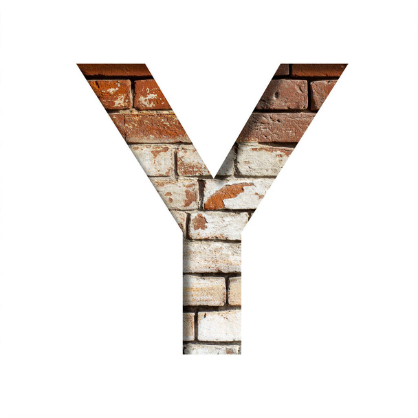 Brick font. The letter Y on the background of an old brick wall with peeled paint. Decorative alphabet from old brickwork. - Photo, Image