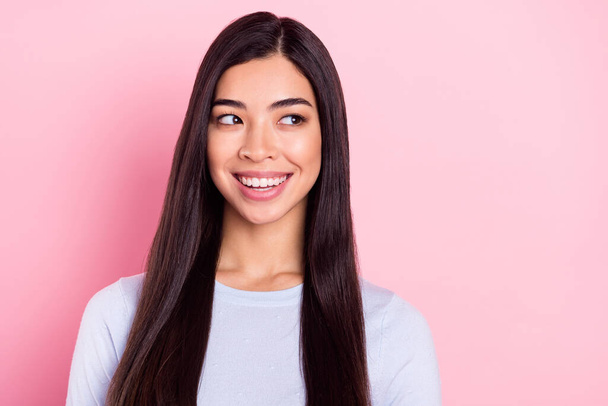 Photo portrait of brunette wearing blue sweatshirt smiling happy looking blank space isolated on pastel pink color background - Φωτογραφία, εικόνα