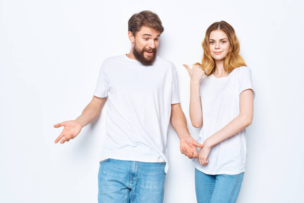 young couple white t-shirts fun lifestyle posing communication - Foto, imagen