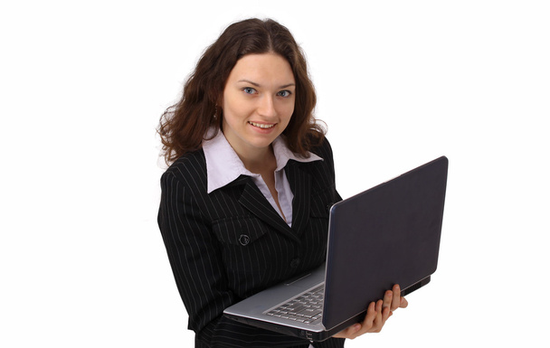 Attractive woman with laptop in hands smiling - Fotoğraf, Görsel
