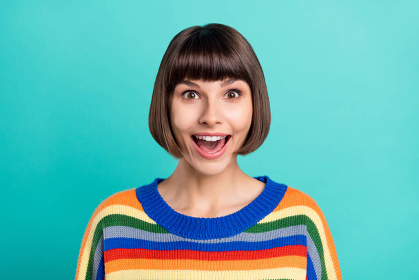 Photo of young excited woman happy positive smile amazed shocked news isolated over turquoise color background - Foto, imagen