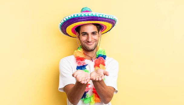 hispanic handsome man smiling happily with friendly and  offering and showing a concept. mexican party concept - Foto, immagini
