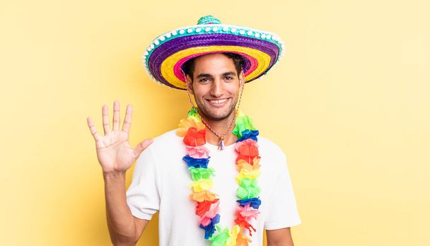 hispanic handsome man smiling and looking friendly, showing number five. mexican party concept - Zdjęcie, obraz