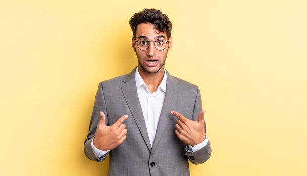 hispanic handsome man feeling happy and pointing to self with an excited. business concept - Photo, Image