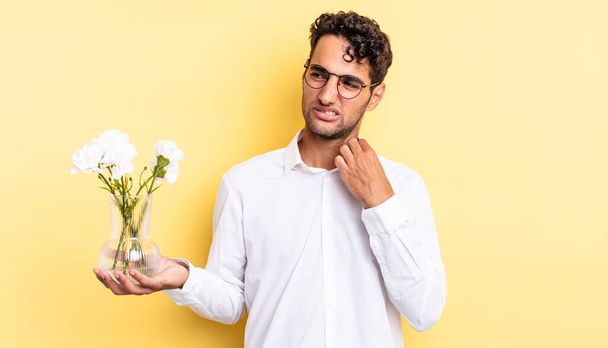 hispanic handsome man feeling stressed, anxious, tired and frustrated. flowers pot concept - Foto, Imagem