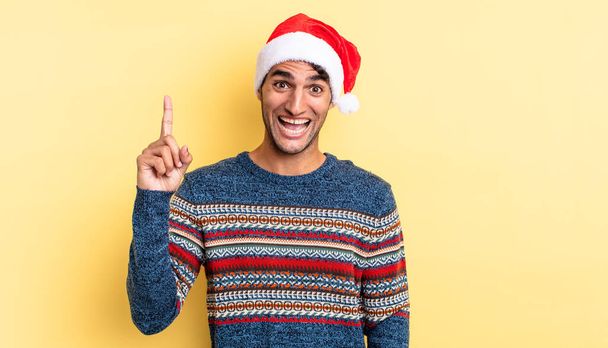 hispanic handsome man feeling like a happy and excited genius after realizing an idea. christmas concept - Fotoğraf, Görsel