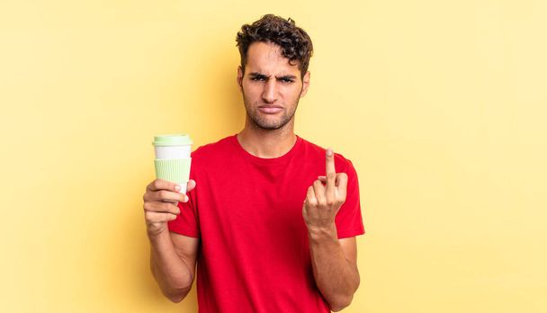 hispanic handsome man feeling angry, annoyed, rebellious and aggressive. take away coffee concept - Photo, image