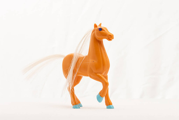 Plastic toy horse on white background. - Photo, Image