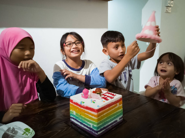 Kuala Lumpur, Malaysia - May 31, 2019: Family celebrating toddler's second birthday at home. - Zdjęcie, obraz
