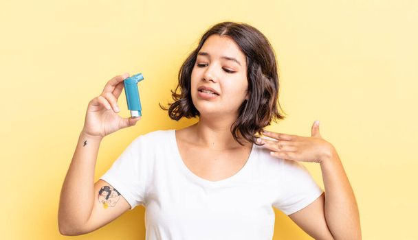 young hispanic woman feeling stressed, anxious, tired and frustrated. asthma concept - Foto, Imagem