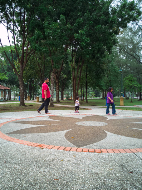 Asian Father running and playing with his children at the park. - Photo, Image