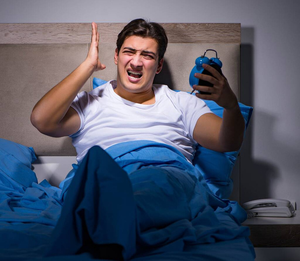Man having trouble sleeping in bed - Photo, Image