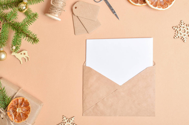Eco-invitation for Christmas and New Year. A congratulatory letter with a place for the text. Flat layout, top view, a place to copy. - Foto, Imagen
