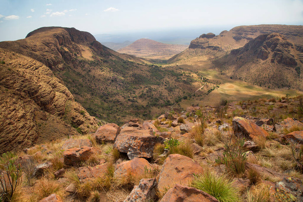 African mountain landscape with rough rocky terrain and low bush fields - Photo, Image