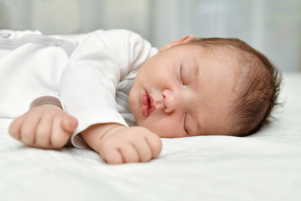 Newborn baby sleep first days in a maternity hospital - Foto, immagini