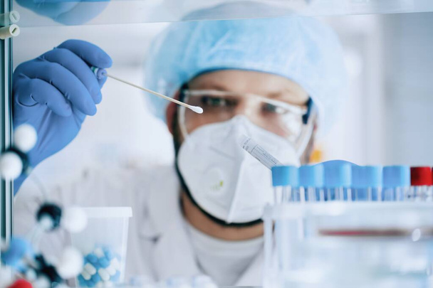  male scientist working in lab with chemical equipment - Фото, зображення