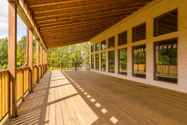 Large wooden veranda in the house - Фото, изображение