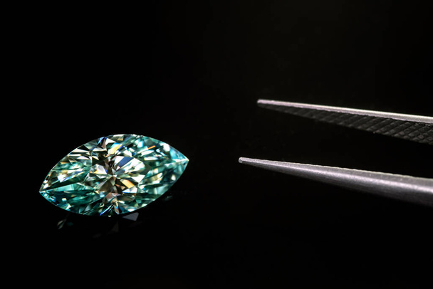 Luxury diamond with tweezers on black background - Foto, Imagem