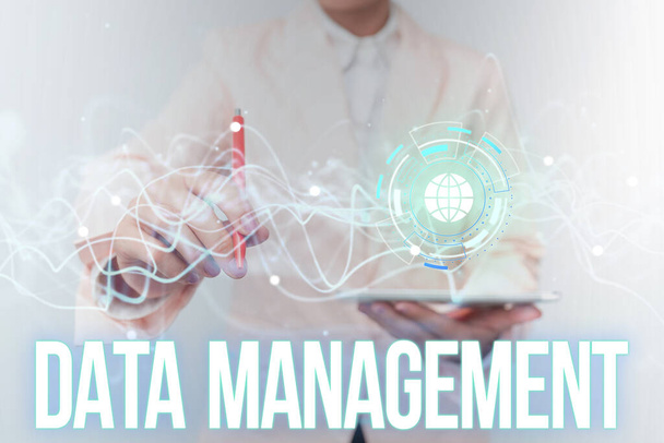 Text caption presenting Data Management. Concept meaning The practice of organizing and maintaining data processes Lady In Uniform Using Futuristic Mobile Holographic Display Screen. - Photo, Image