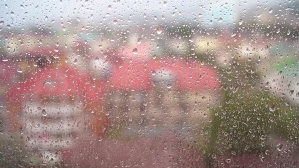 View from the window in rainy weather. Video with a drop that flows down the glass. - Footage, Video