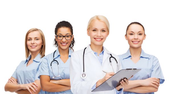 smiling female doctor and nurses with stethoscope - Foto, afbeelding